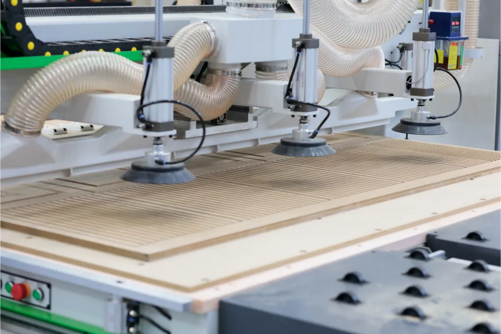 A piece of MDF being manufactured and cut in the factory
