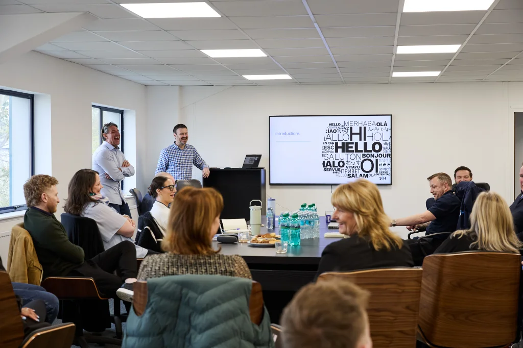 SJH colleagues having a quarterly team meeting in the office