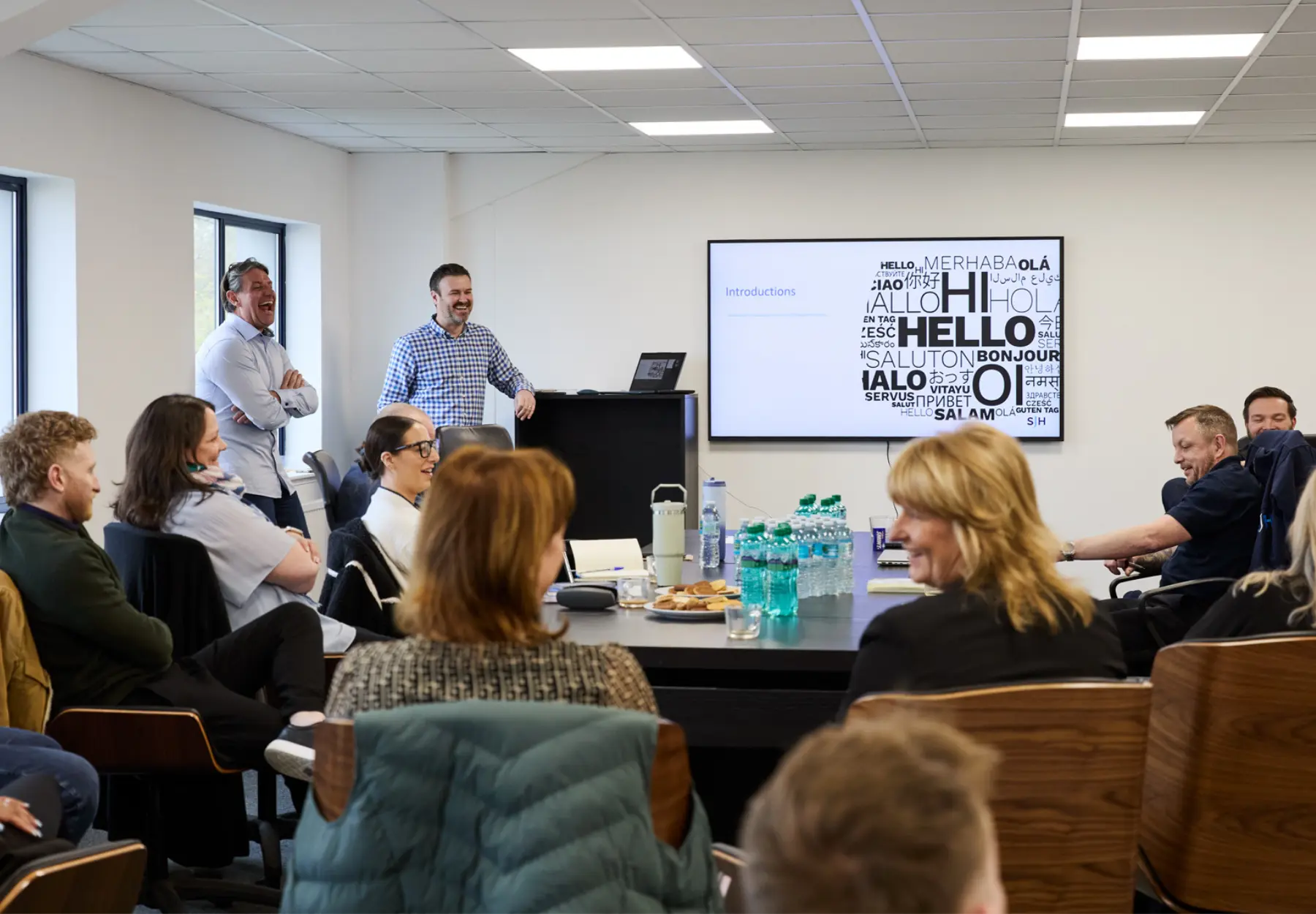 SJH colleagues having a quarterly team meeting in the office