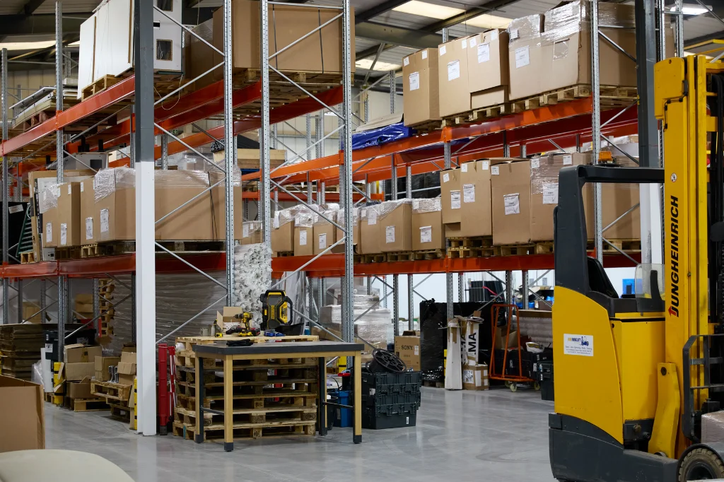Warehouse racking system filled with boxed inventory and pallet storage