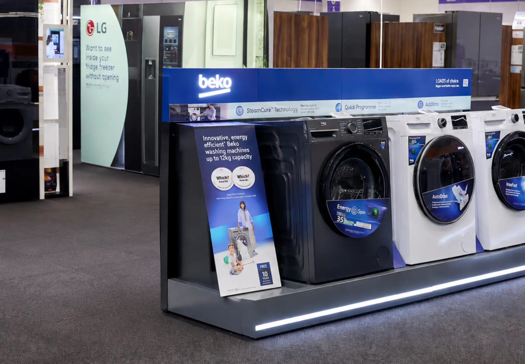 Beko washing machine display featuring on Currys shop floor installed by SJH